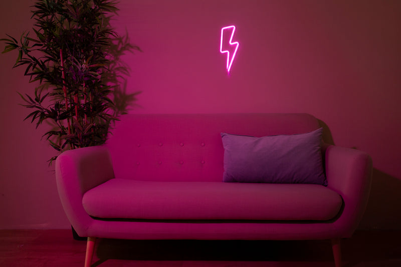 Neon lightning bolt sign glowing safely in a bedroom