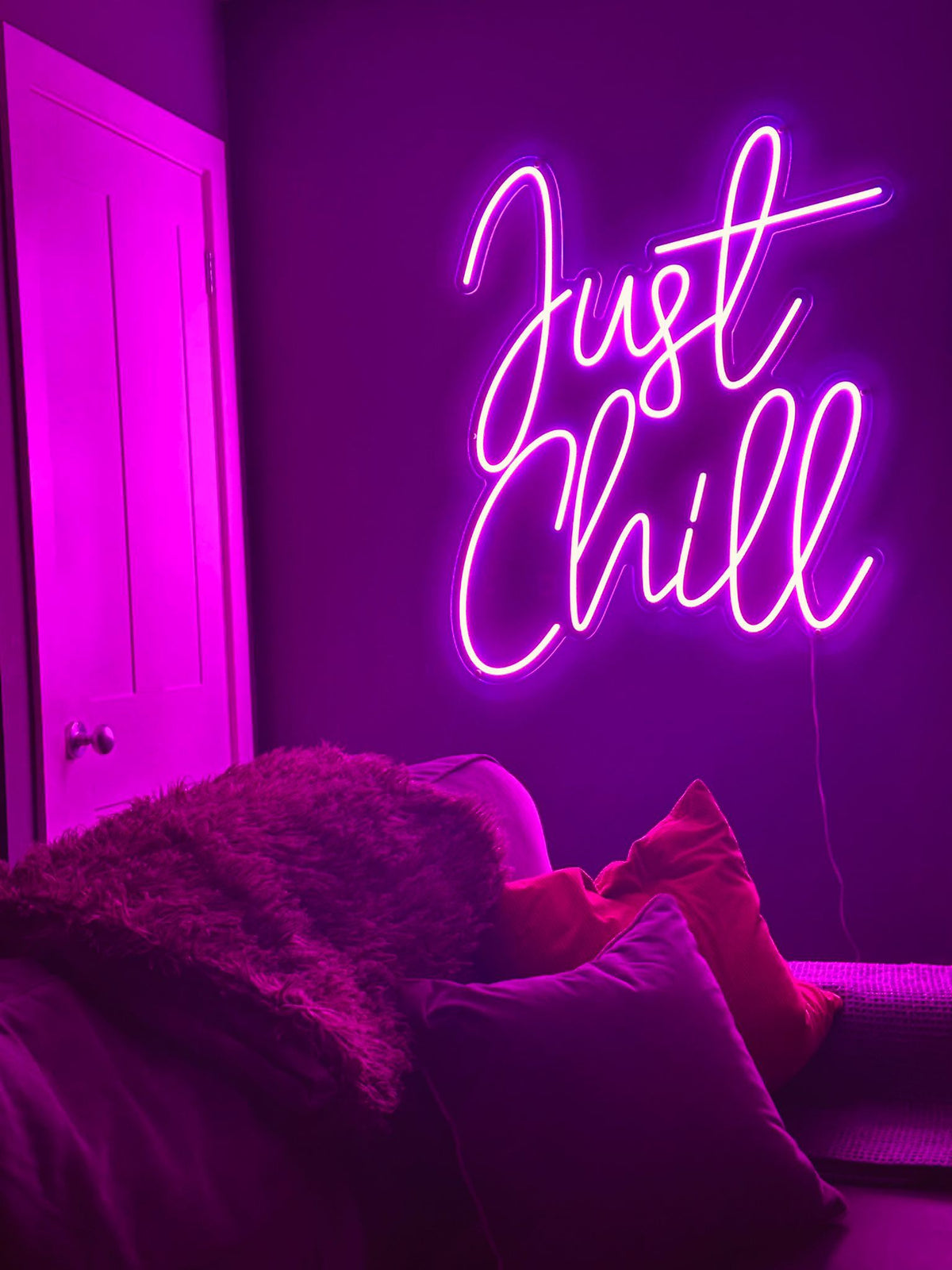 A pink LED neon sign that says "Just Chill"